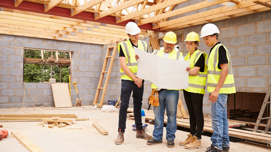 team of construction workers and site managers