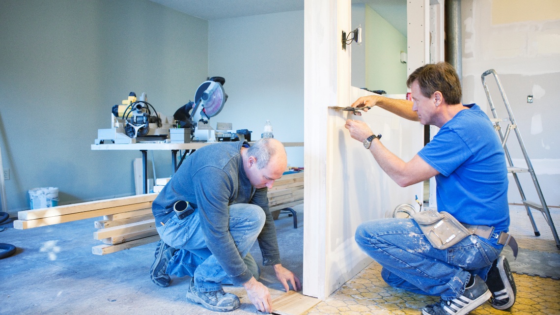 two carpenters working on an indoor home project
