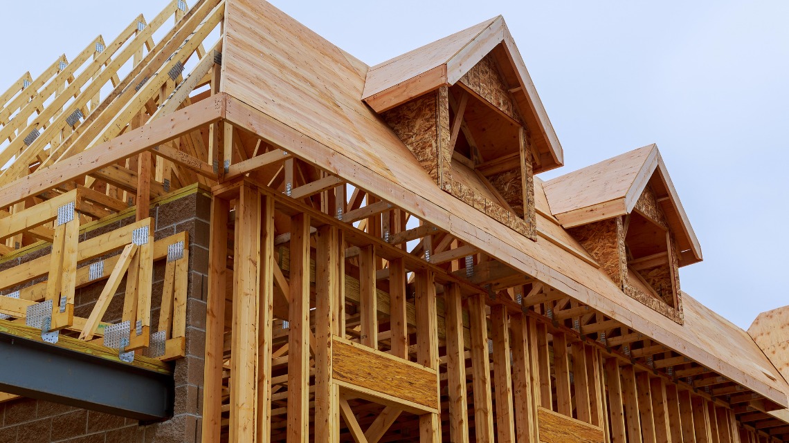 Wooden framing and roof dormers of a building under construction