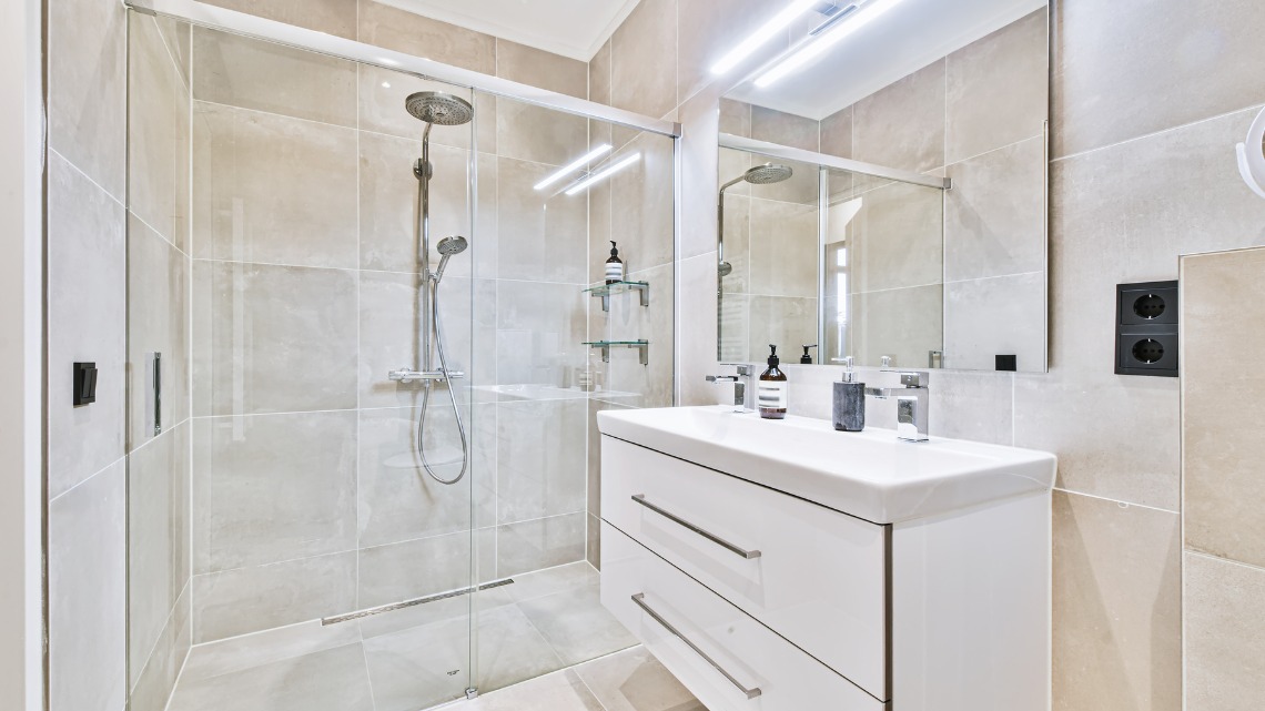 modern beige tiled bathroom