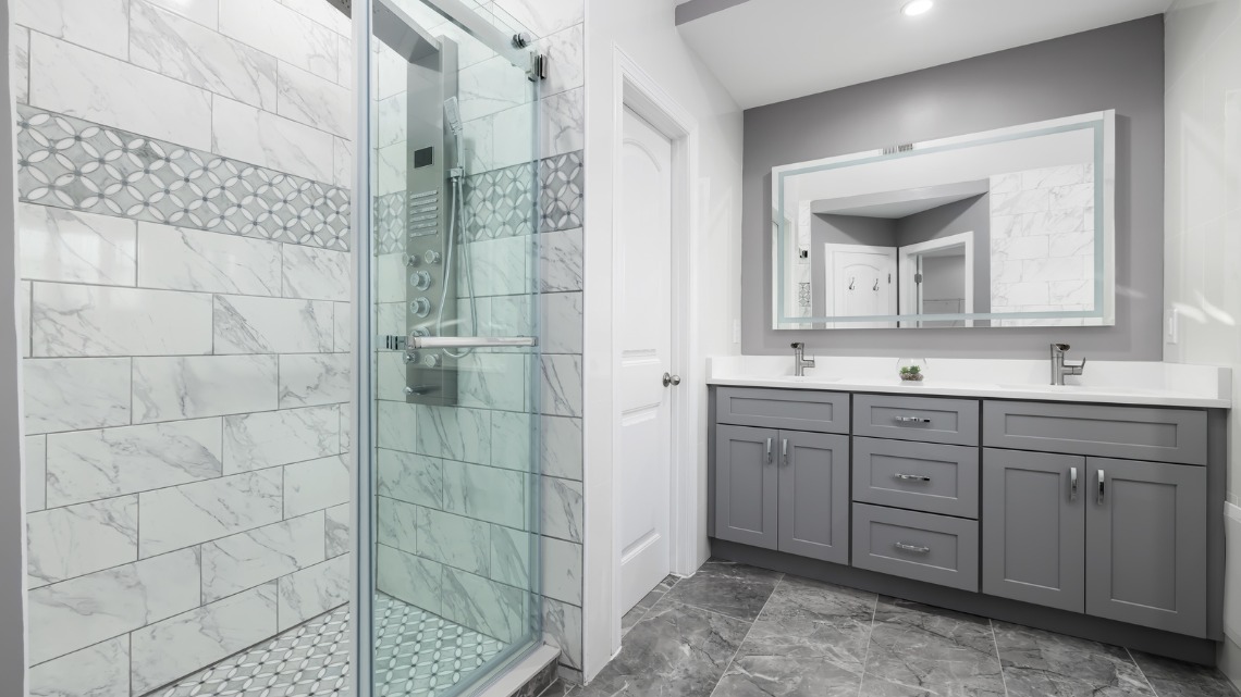 grey bathroom featuring a glass walk-in shower