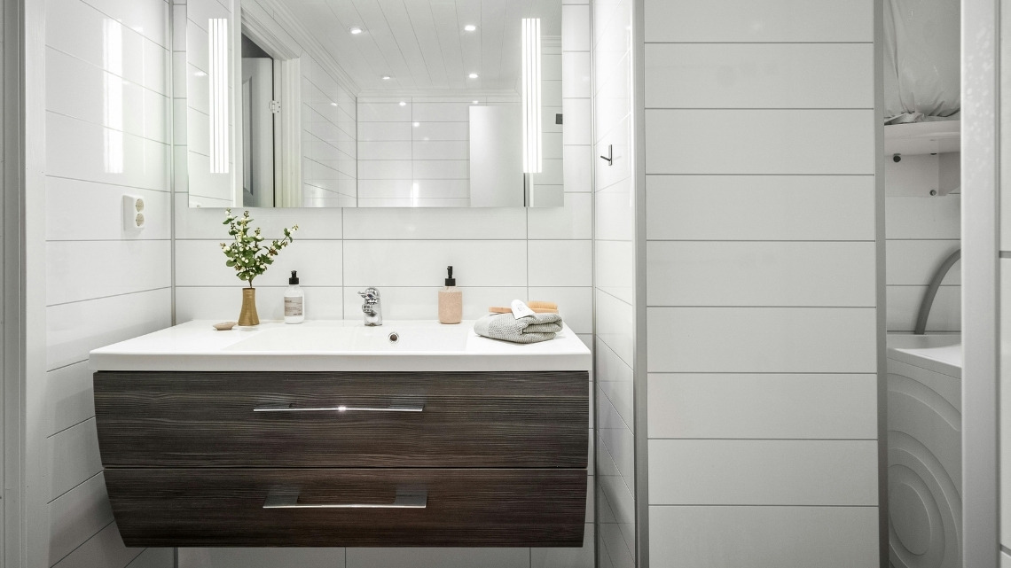 bathroom vanity featuring a dark wood-grain finish