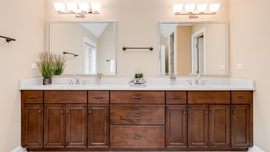 double-sink bathroom vanity featuring rich dark wood cabinetry