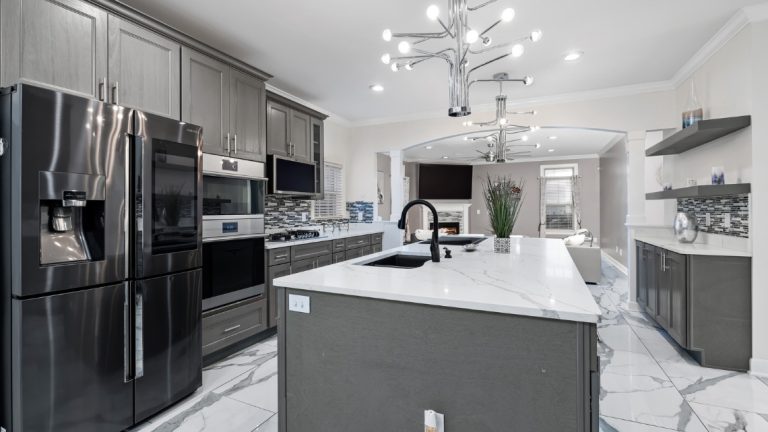 open-concept kitchen featuring grey cabinetry