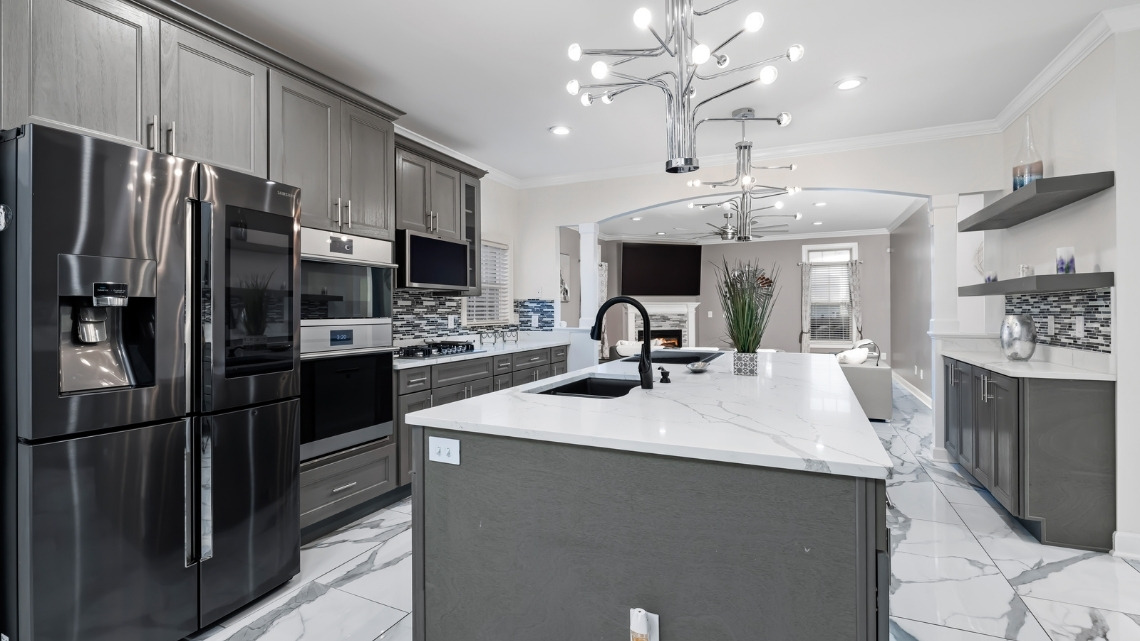 open-concept kitchen featuring grey cabinetry
